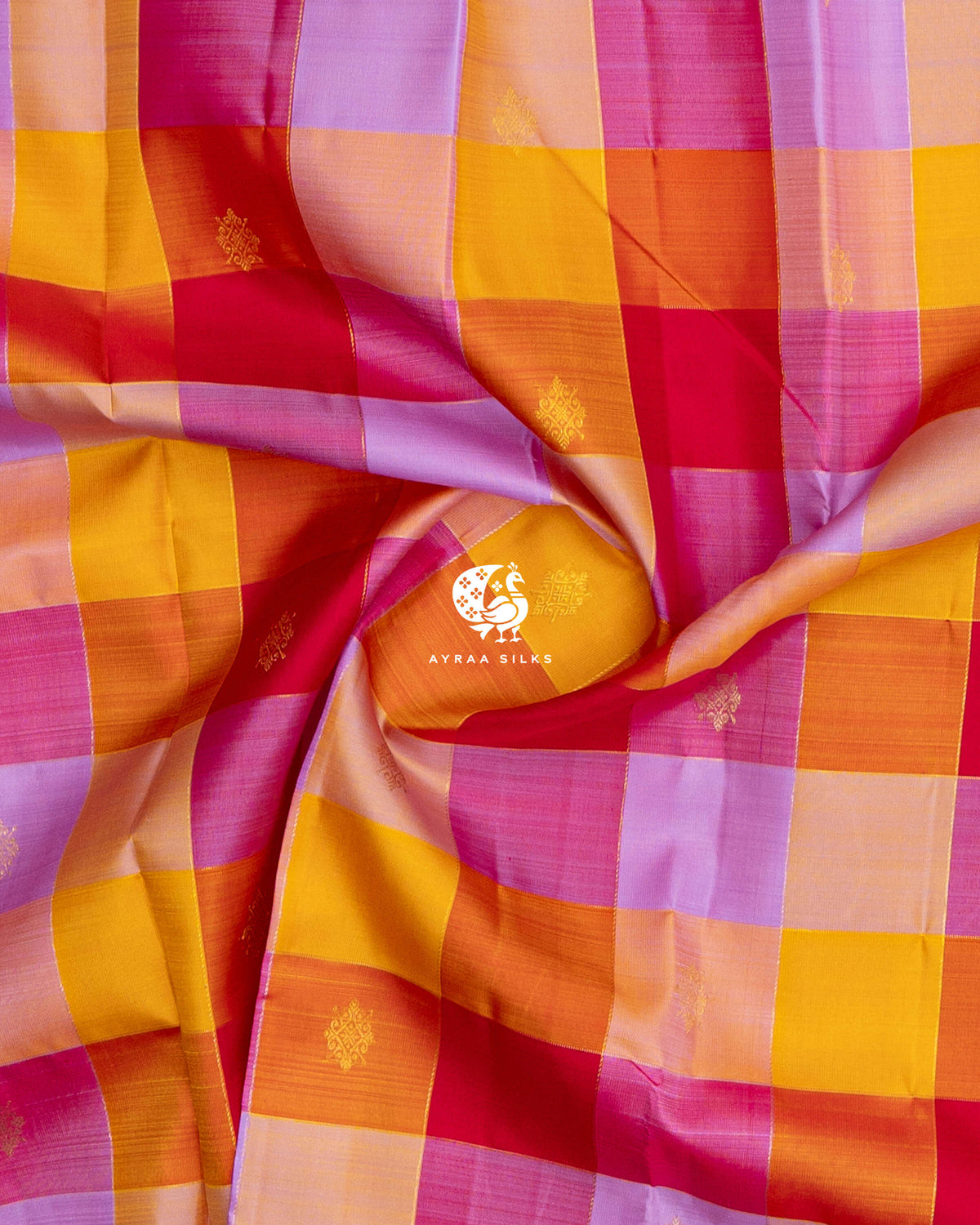 Close-up of the saree body, multicolour Kattam (checks) with kolam zari buttas gathered in soft folds of pure Kanchipuram silk