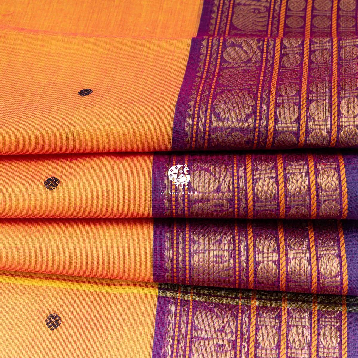 Close view of the purple Ganga Jamuna border showing elephants, peacocks and floral roundels in zari