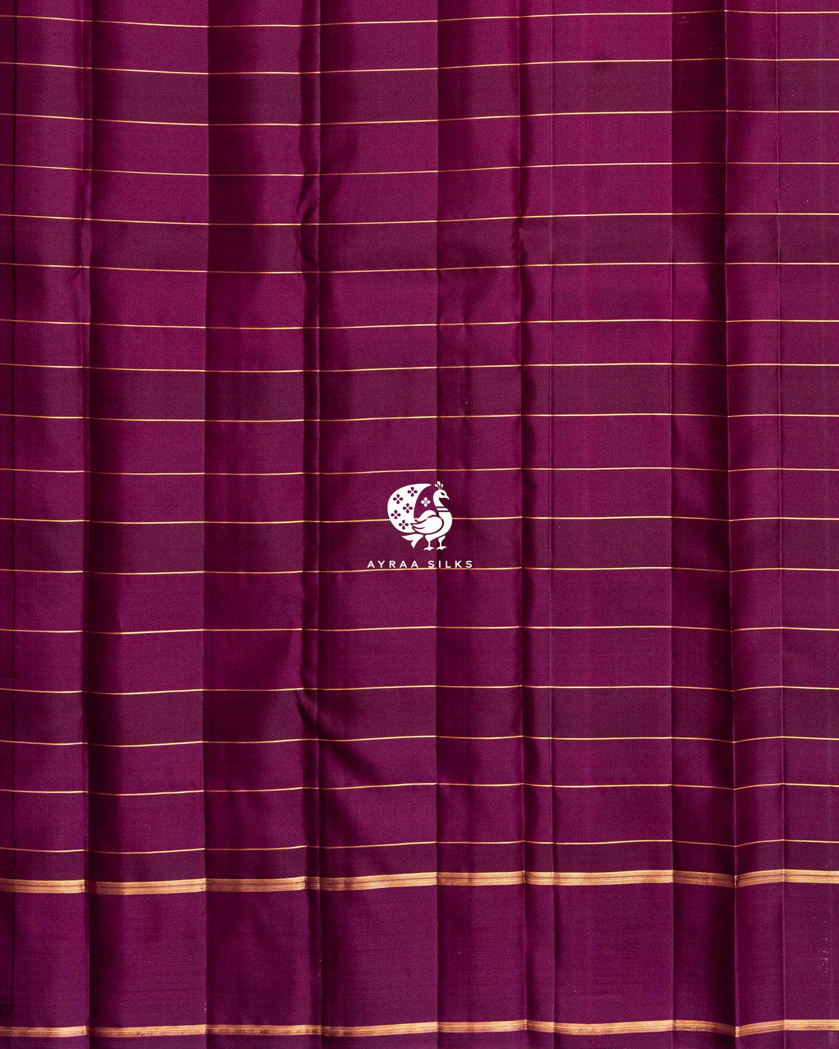 Close view of the running blouse in plain wine silk with fine zari lines