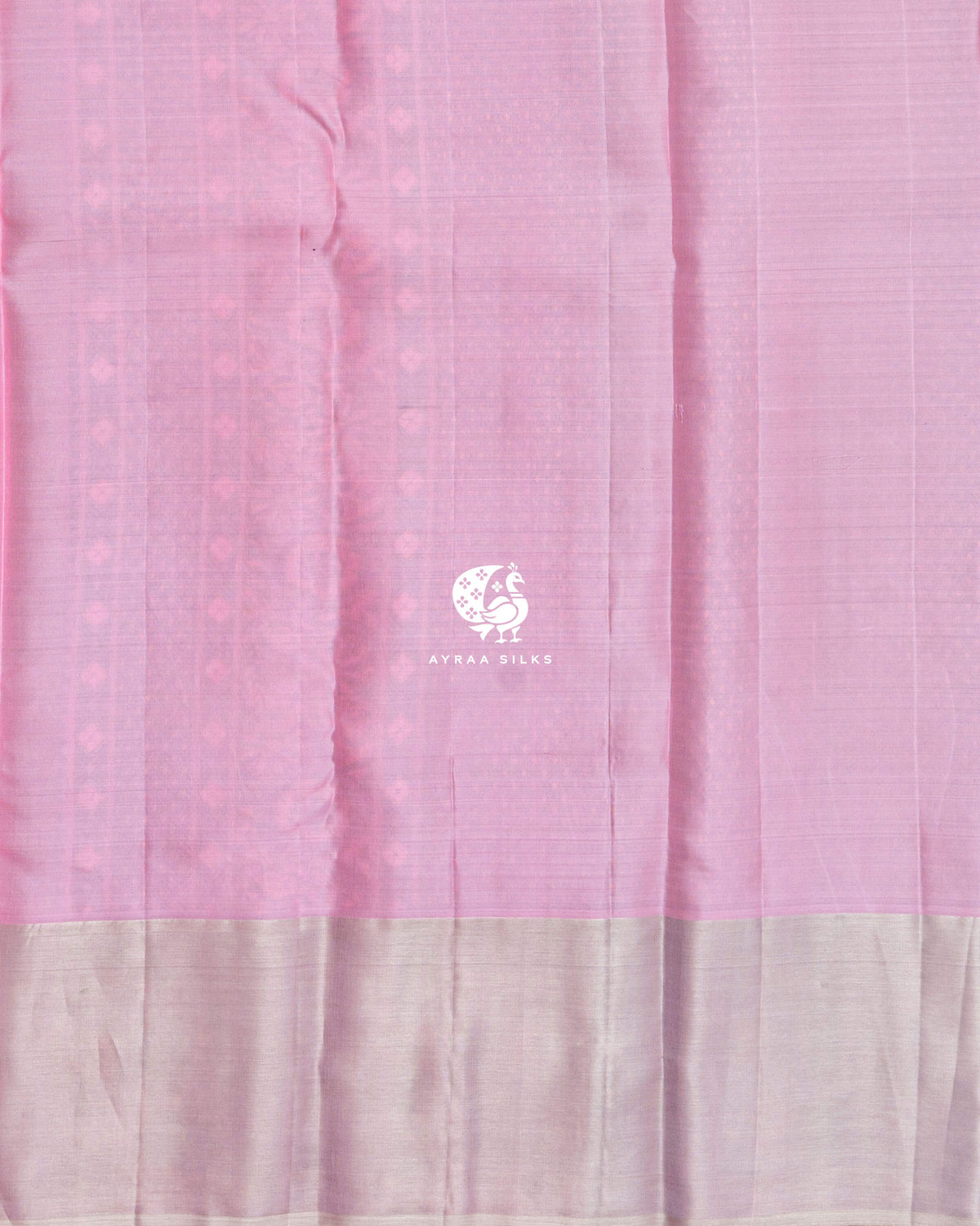 Close view of the running blouse in pastel pink silk with a zari border