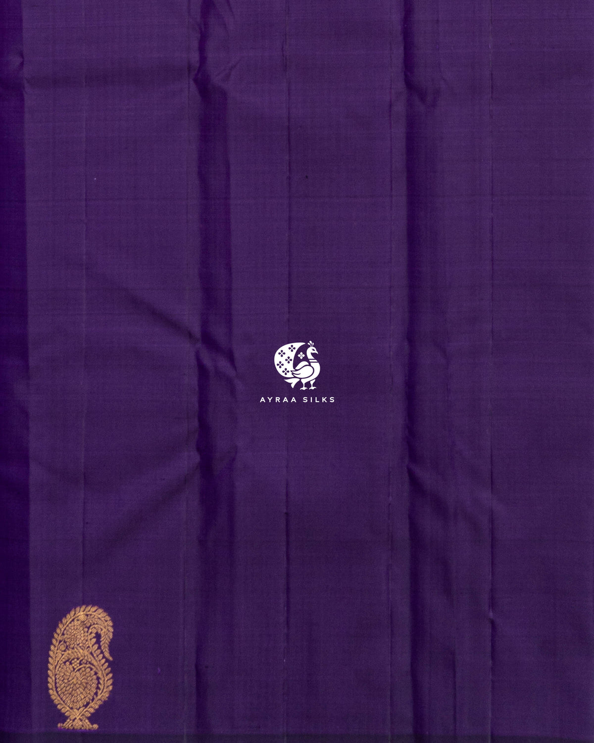 Close view of the running blouse in plain purple silk with a manga (paisley) zari butta