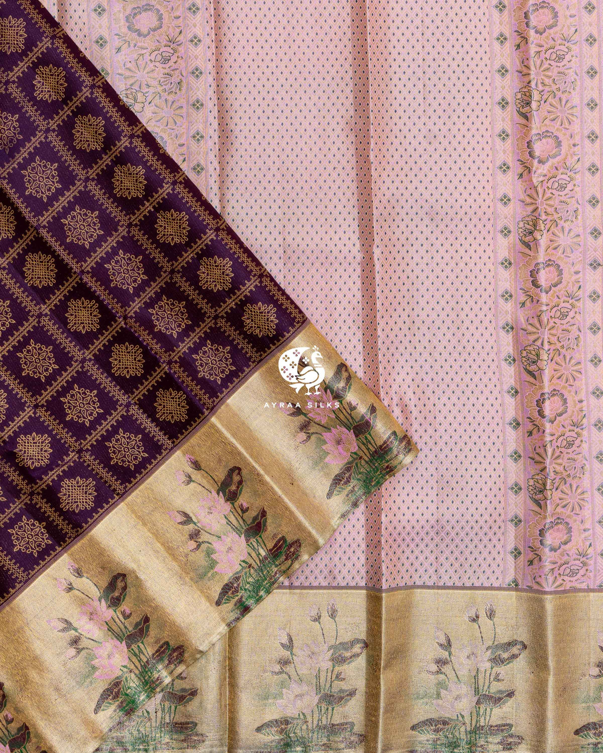 Pleats of Jamun Purple Kolam Kanchipuram silk saree with gold zari lotus border laid over its pastel pink zari pallu