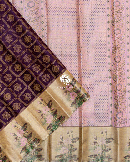 Pleats of Jamun Purple Kolam Kanchipuram silk saree with gold zari lotus border laid over its pastel pink zari pallu