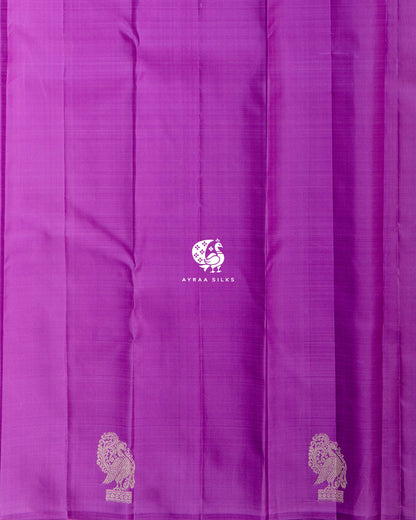 Close view of the running blouse in purple pure Kanchipuram silk with silver zari Annam buttas