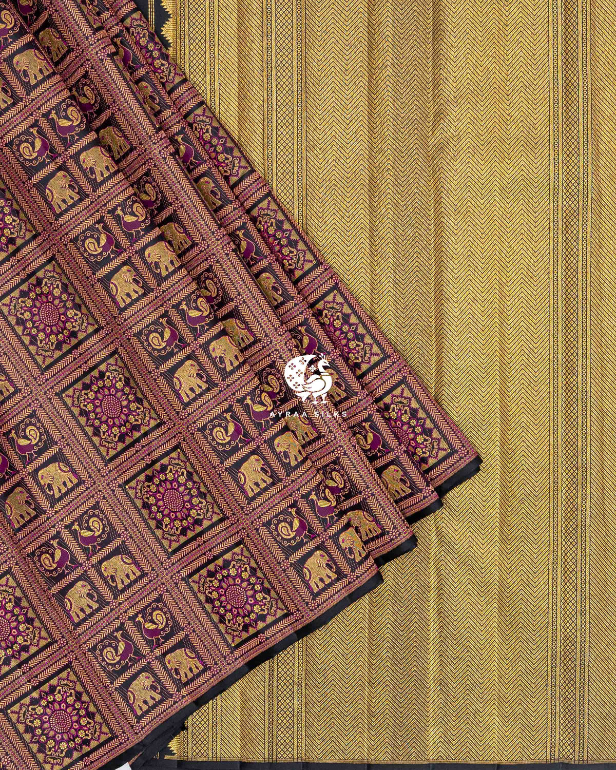 Black brocade pleats with elephant and peacock checks laid over the gold zari chevron pallu