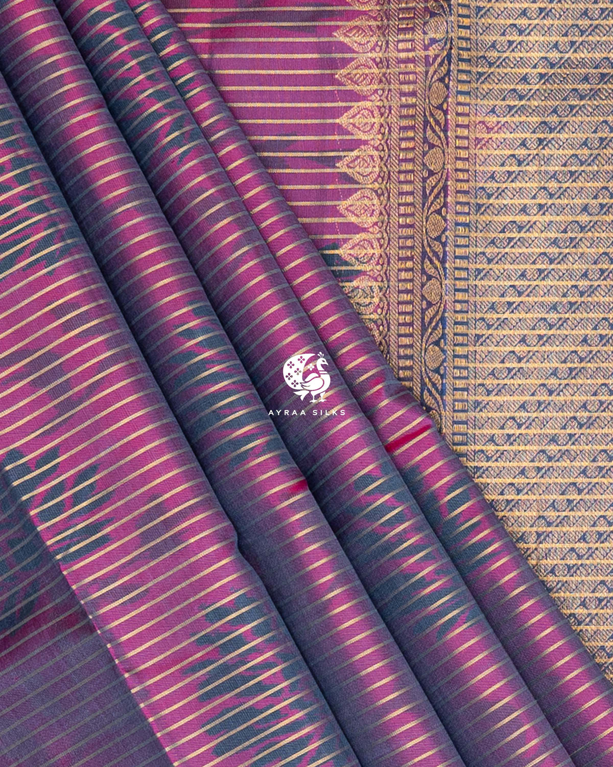 Close view of the pleats and the kovil (temple) edge where the zari pallu meets the magenta ikat body, Magenta and Slate Blue Ikat Ginkgo Moon Kanchipuram silk saree, Ayraa Silks