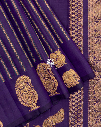 Close view of manga (paisley), Yaanai (elephant) and Mayil (peacock) zari buttas on the self colour purple border