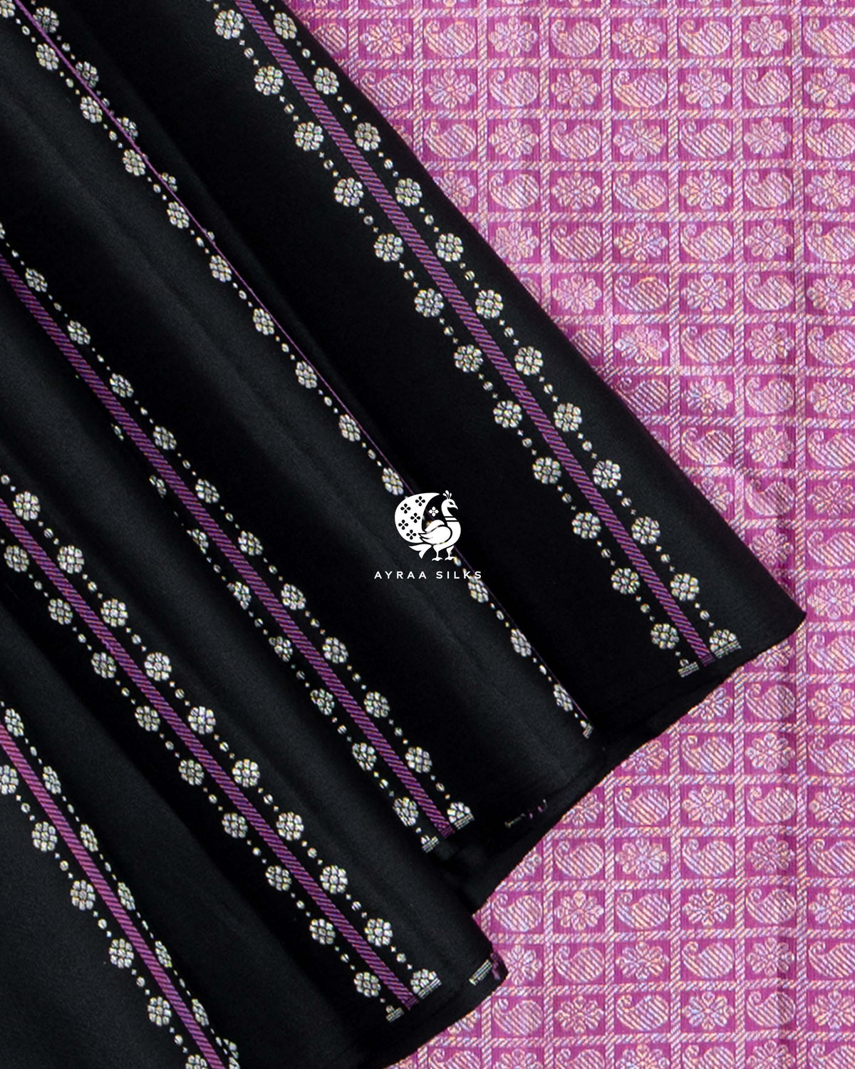 Close view of black striped silk pleats with floral zari buttas against the manga and floral zari grid of the pallu