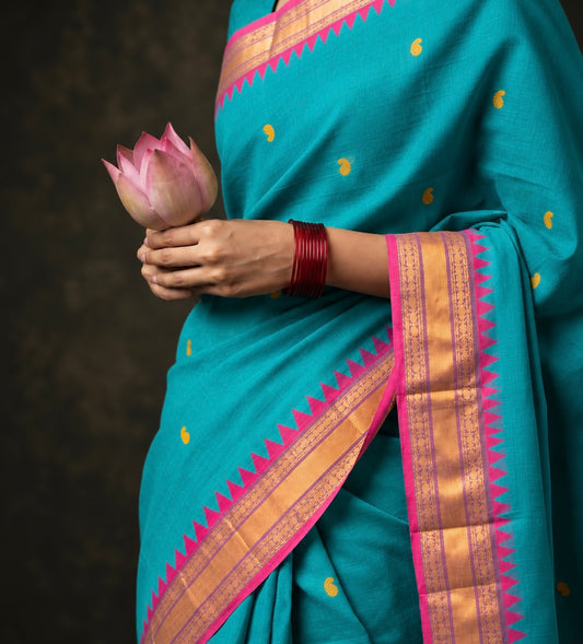 Teal green butta Kanchi cotton saree draped, pink zari temple border and yellow thread buttas — handwoven pure cotton by Ayraa Silks