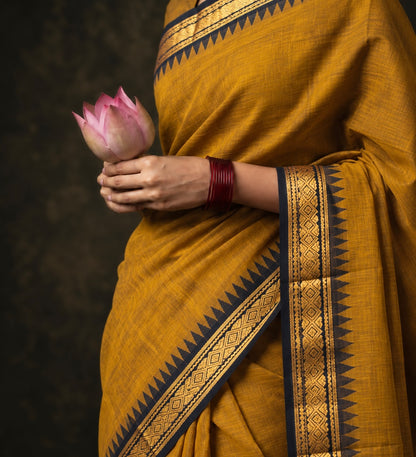 Mustard temple border Kanchi cotton saree draped, black and gold zari border — handwoven pure cotton by Ayraa Silks