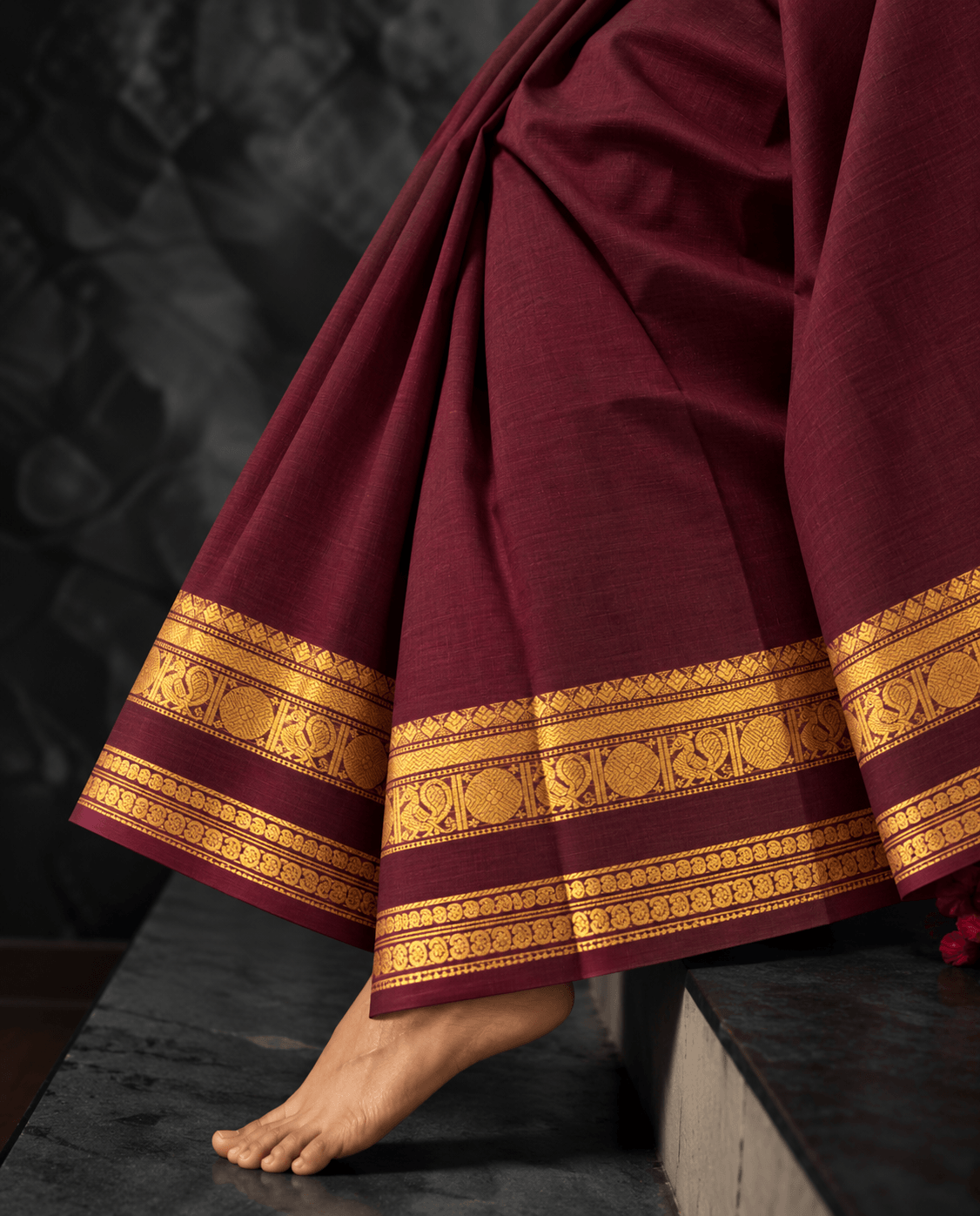 Maroon Kanchi cotton saree draped, self colour border with gold zari roundels — handwoven pure cotton by Ayraa Silks