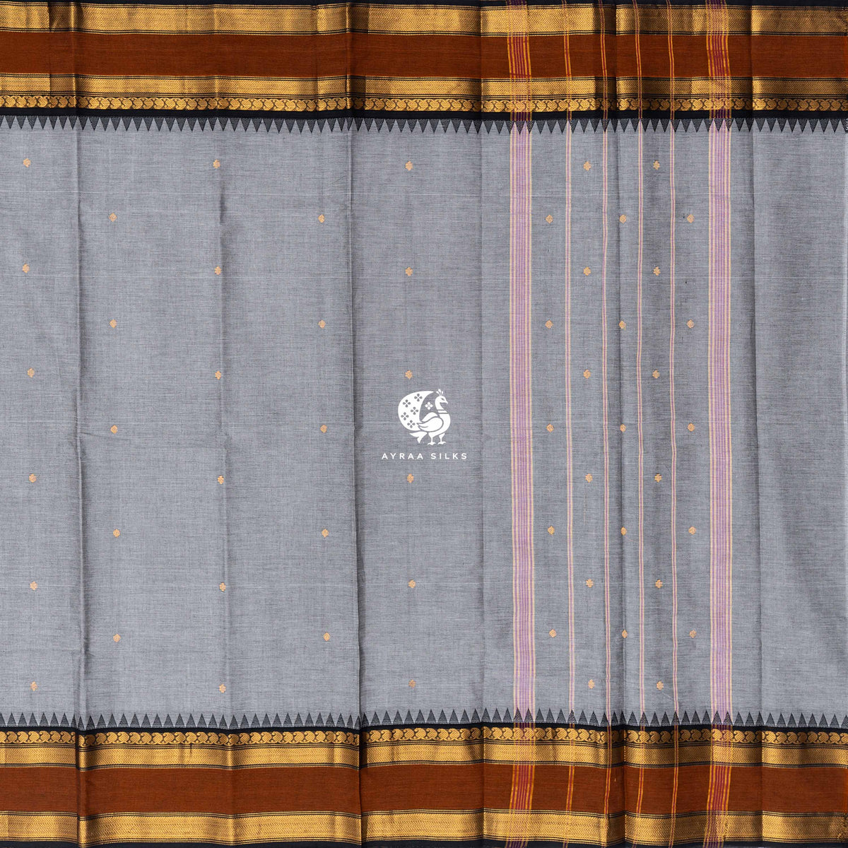 Grey Kanchi cotton saree laid flat, pallu with stripes and zari buttas, rust temple borders both sides
