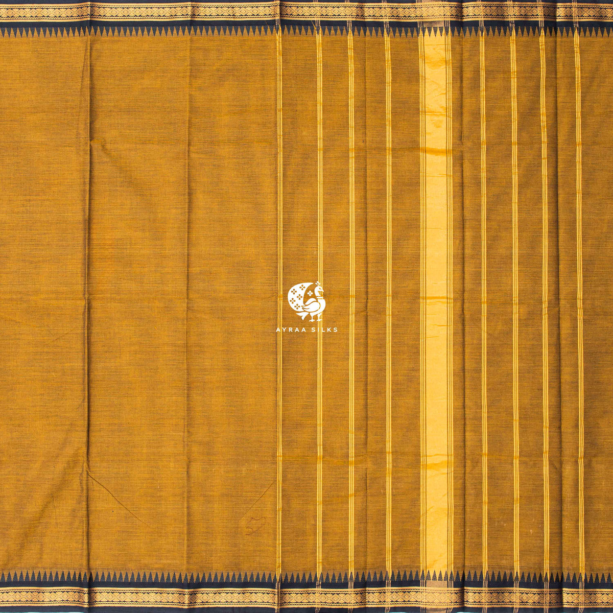 Mustard Kanchi cotton saree laid flat, pallu with zari lines and black temple borders on both sides