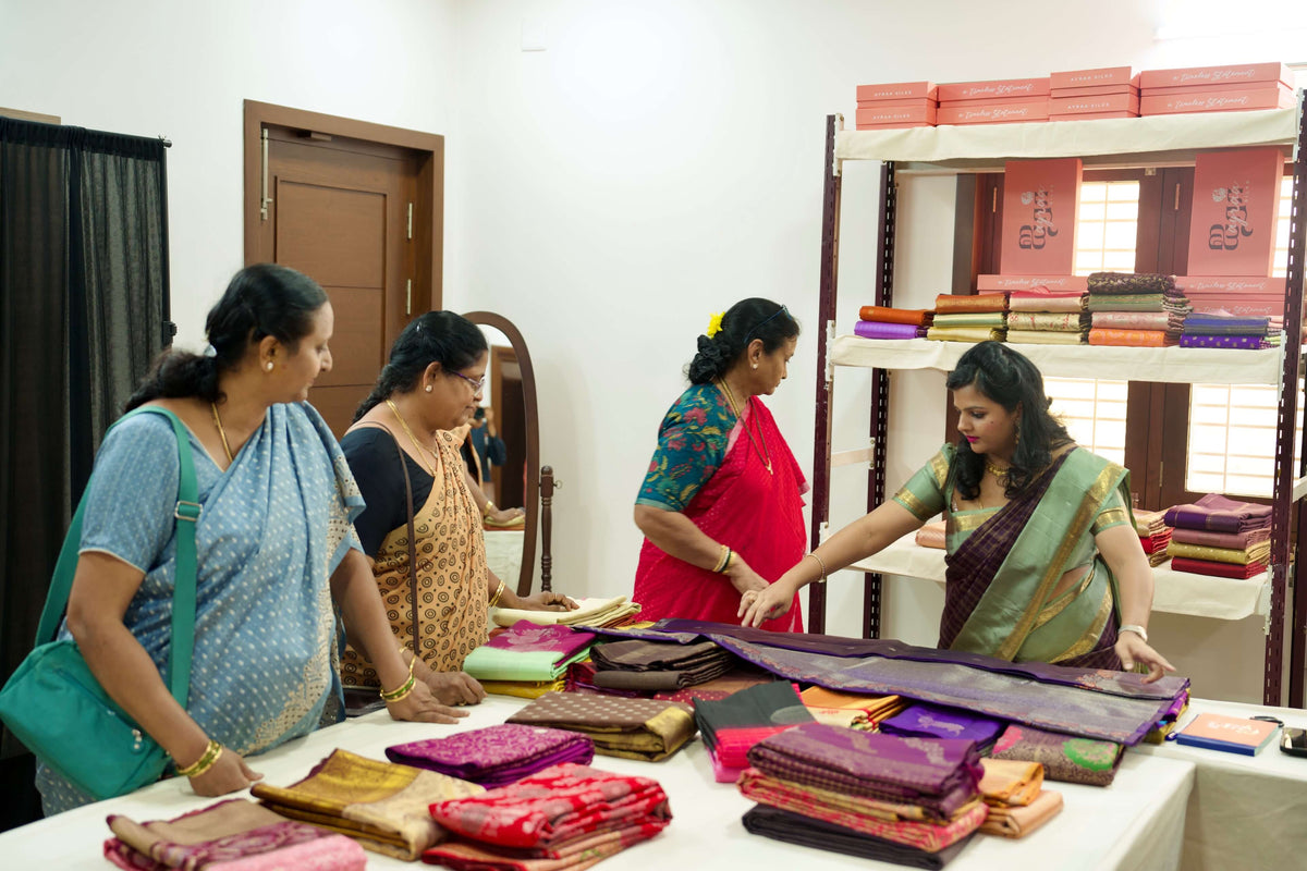 Sahana Gowtham guiding women through a private viewing of Kanchipuram silk sarees at the Ayraa Silks Pop-up in Bengaluru